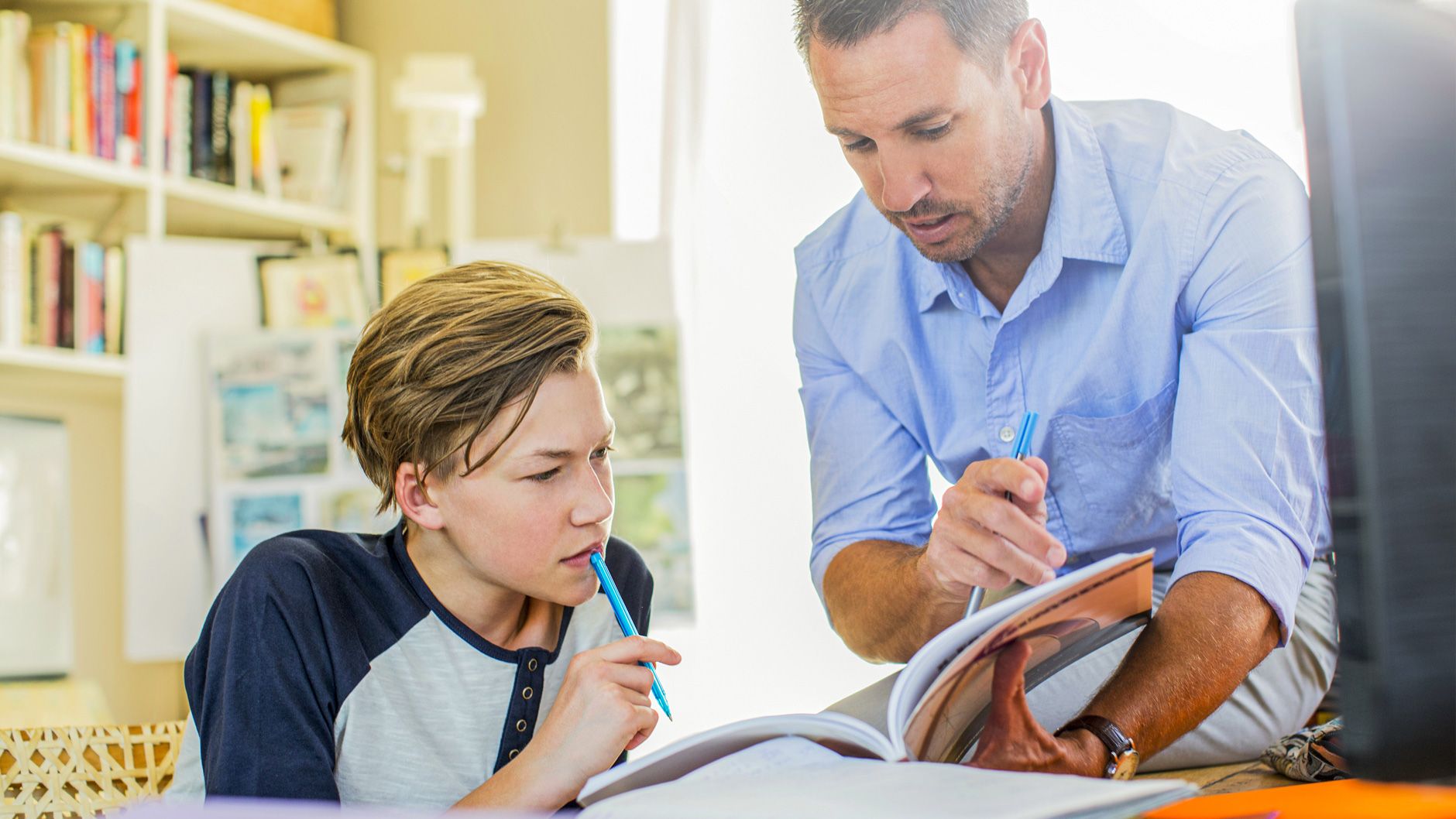 Tutor helping a learner study